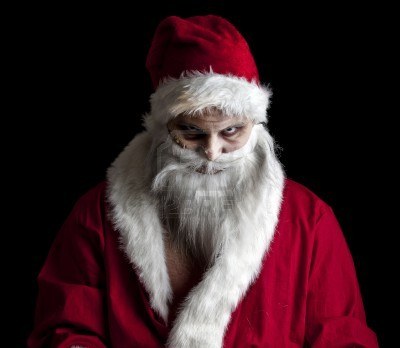 8462644-a-scary-looking-santa-holding-a-glowing-present-bag.jpg